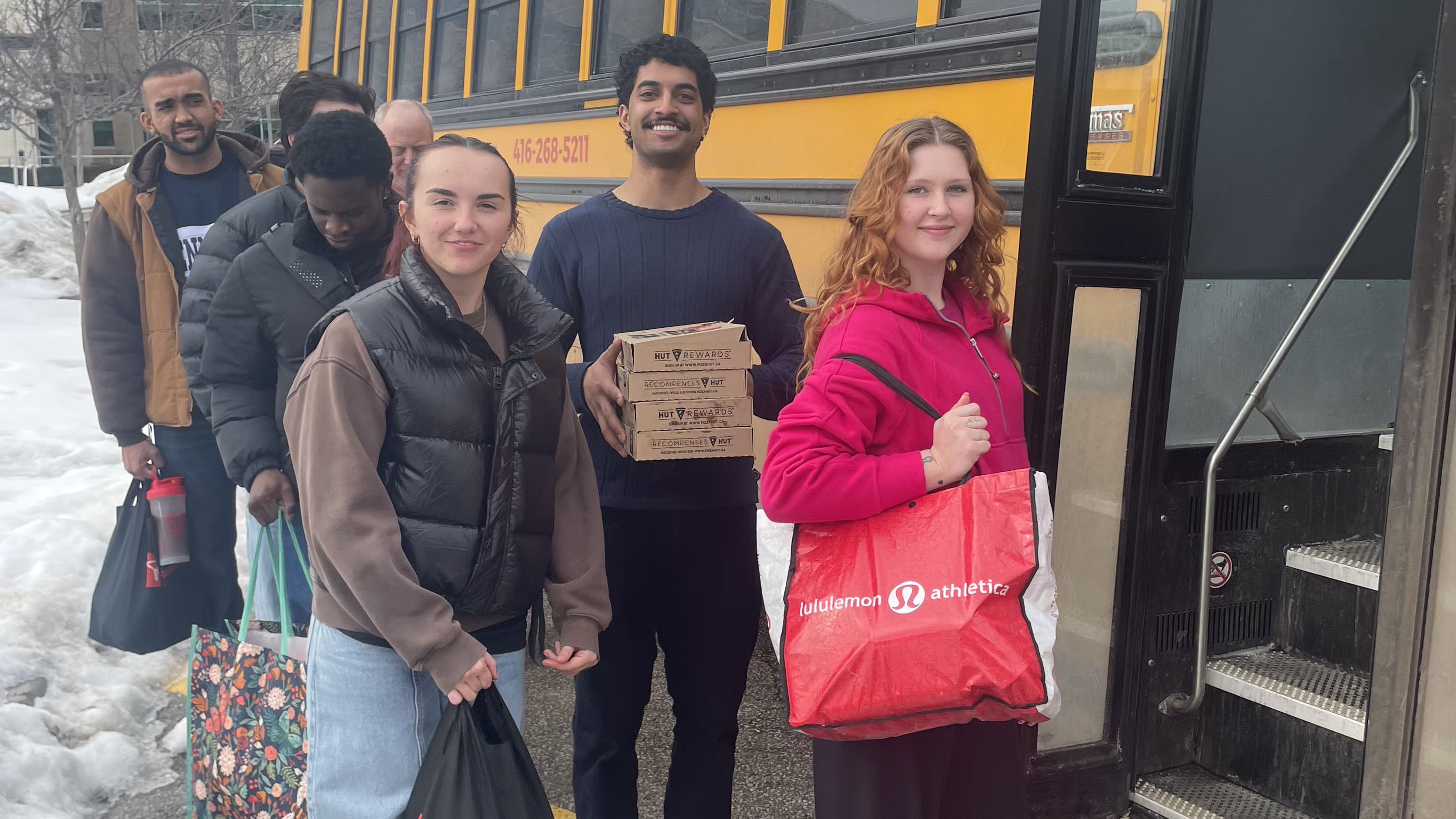 Students board the yellow school bus