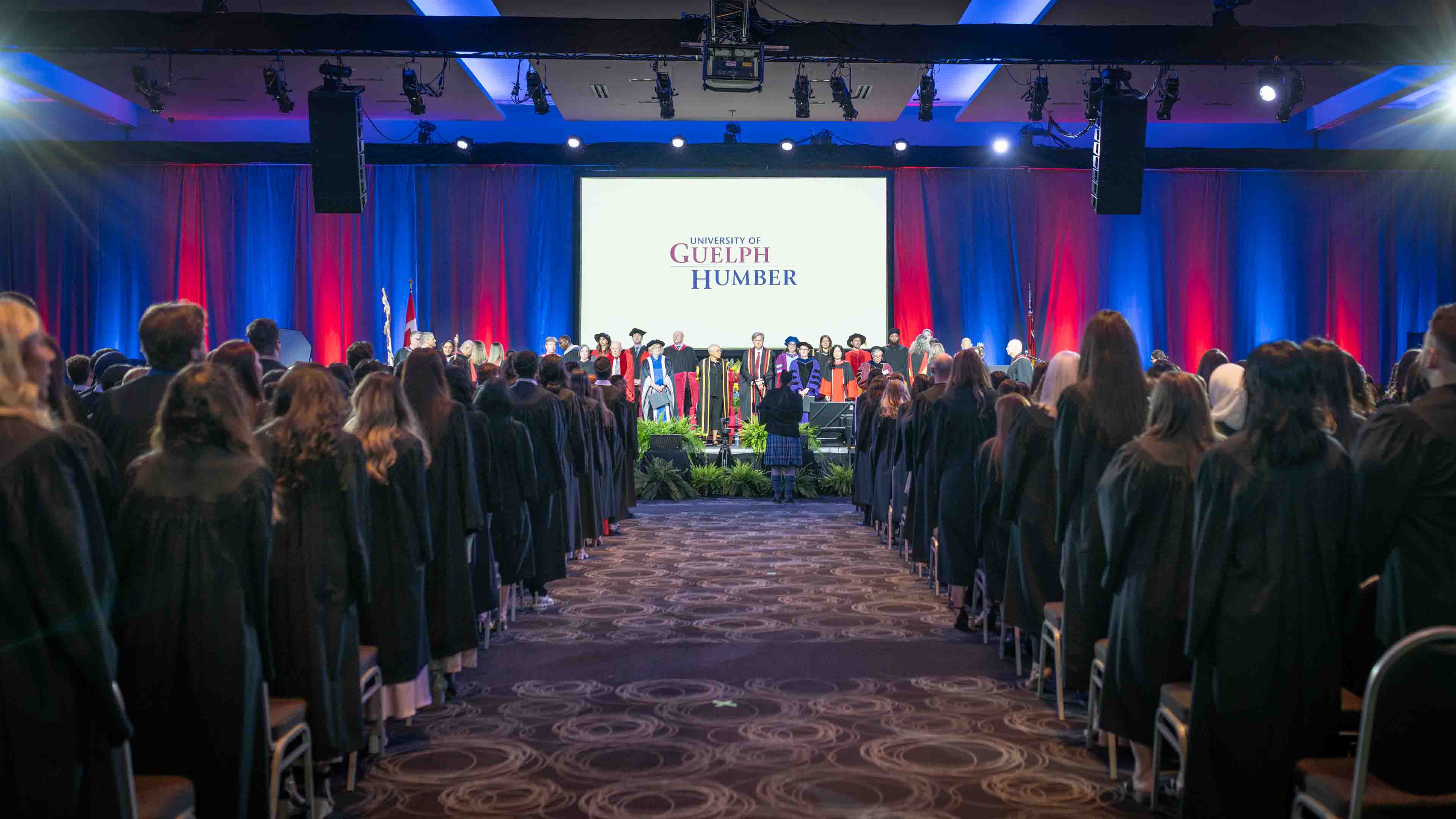 Guelph-Humber Convocation with graduates seated in front of the stage