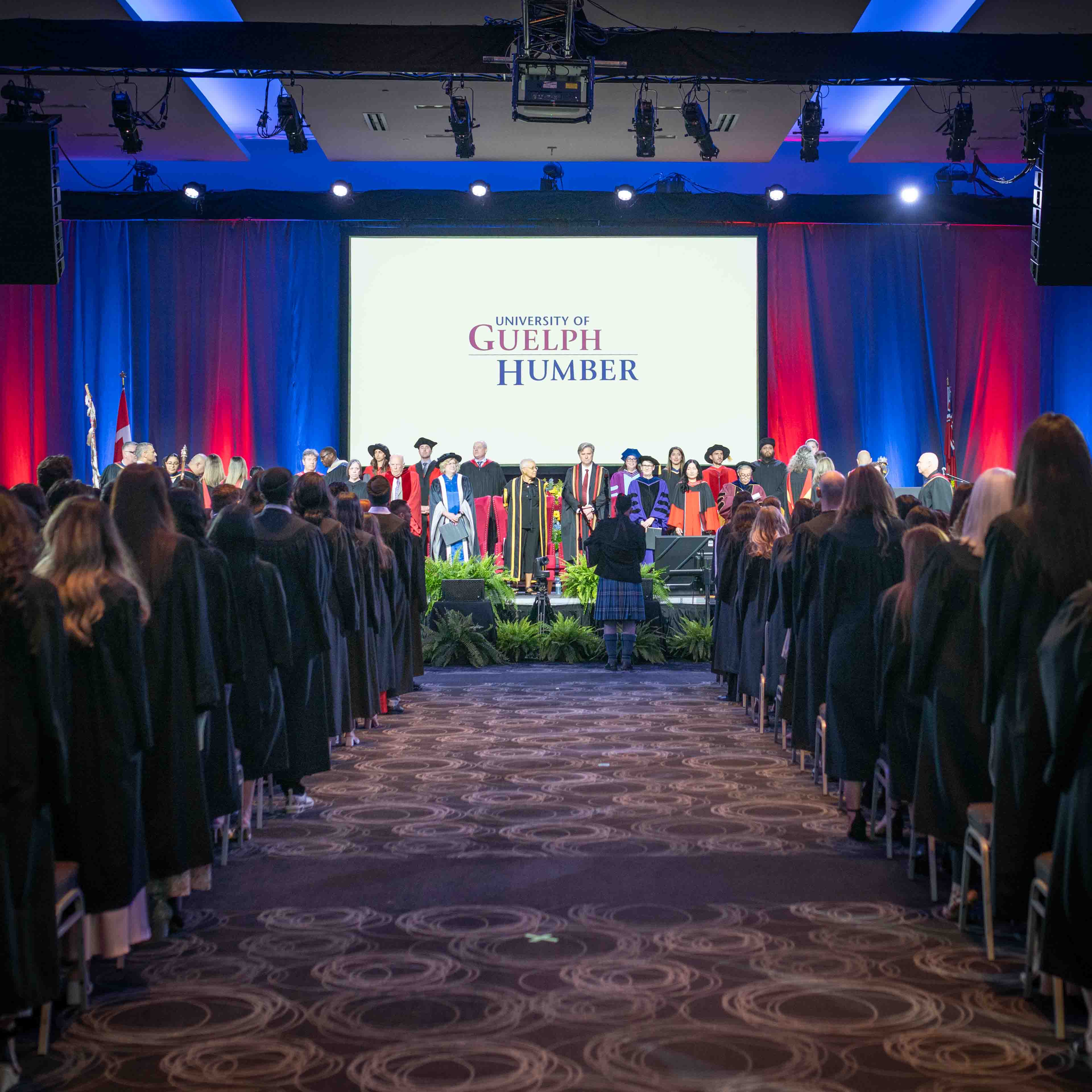 Guelph-Humber Convocation with graduates seated in front of the stage