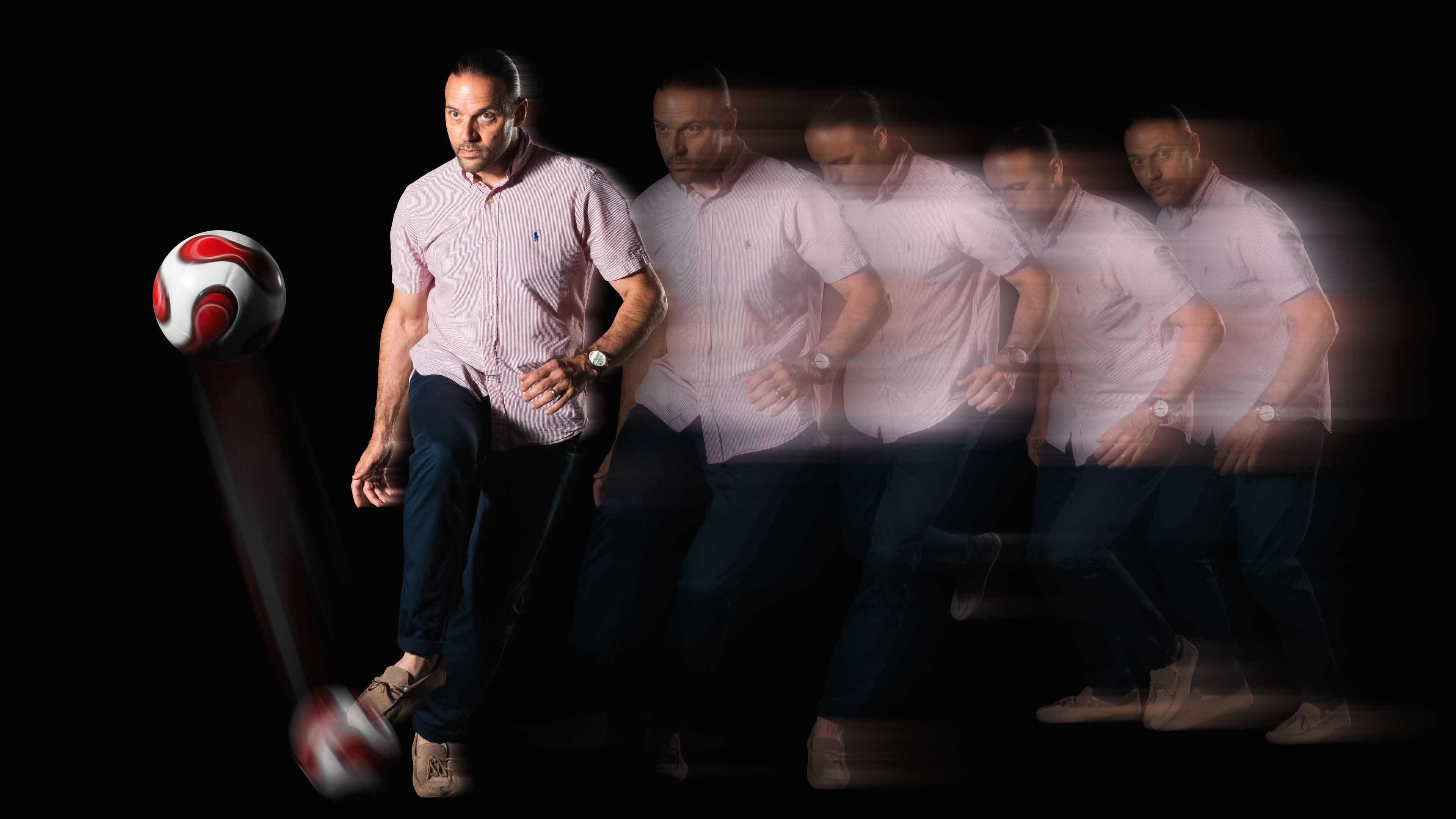 Motion photo of Dr. Richard Bucciarelli kicking a soccer ball