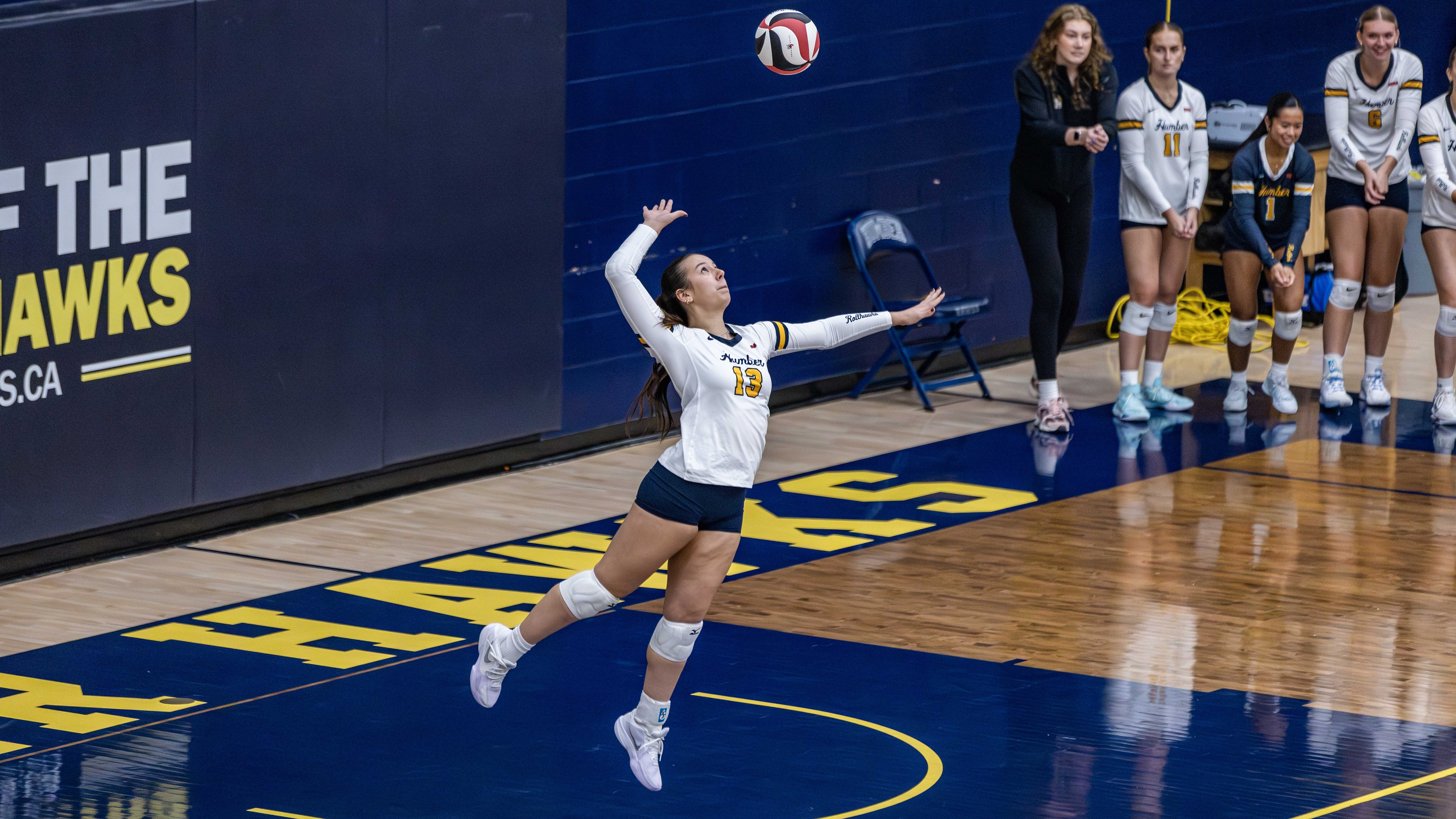 Jiindazay jumps to hit a volleyball