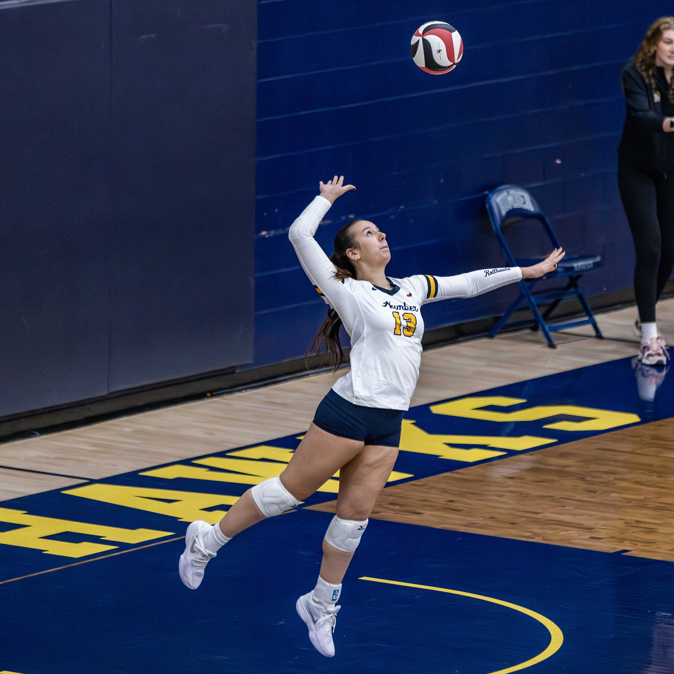 Jiindazay jumps to hit a volleyball