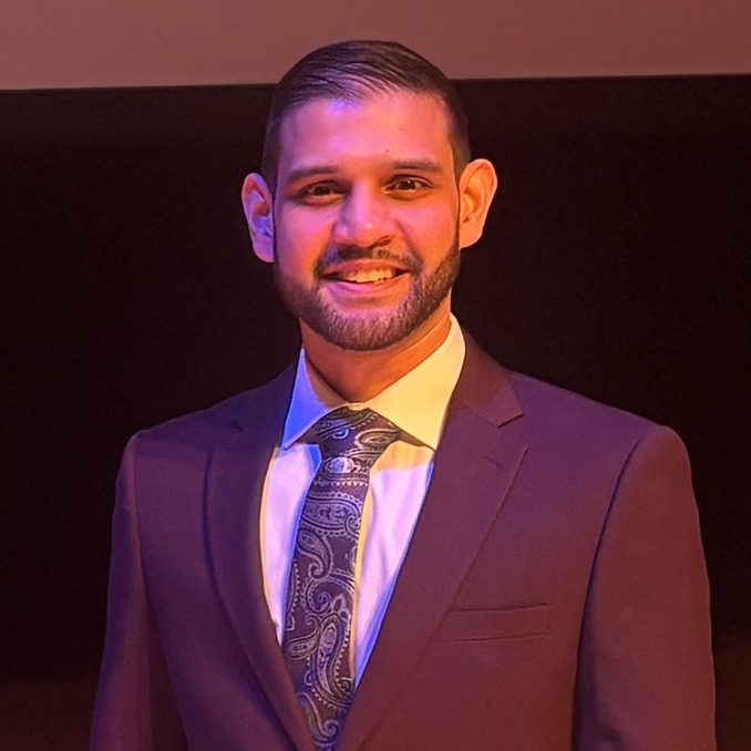 Basim Salim standing on a stage