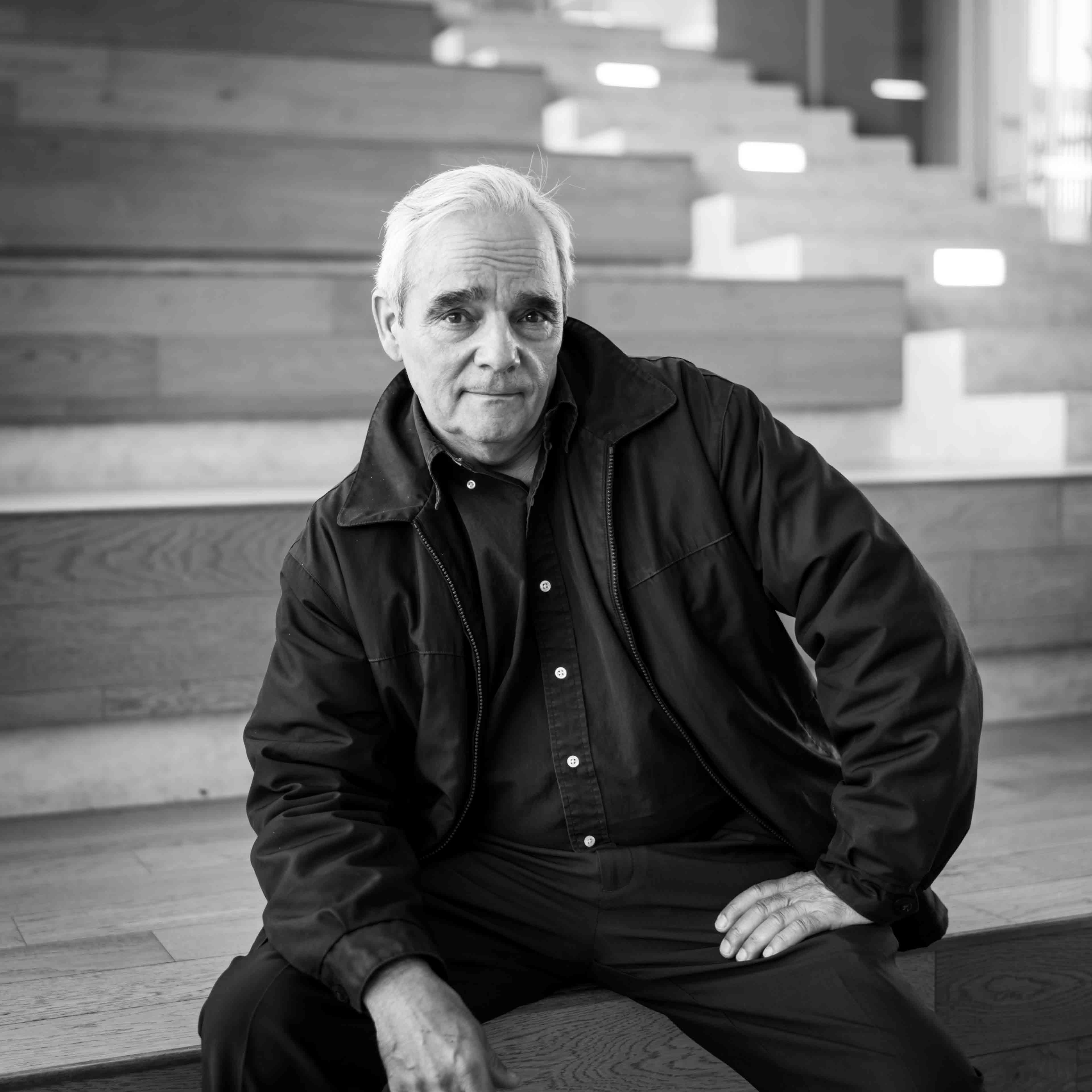 Guy Paul Morin sits on wooden steps