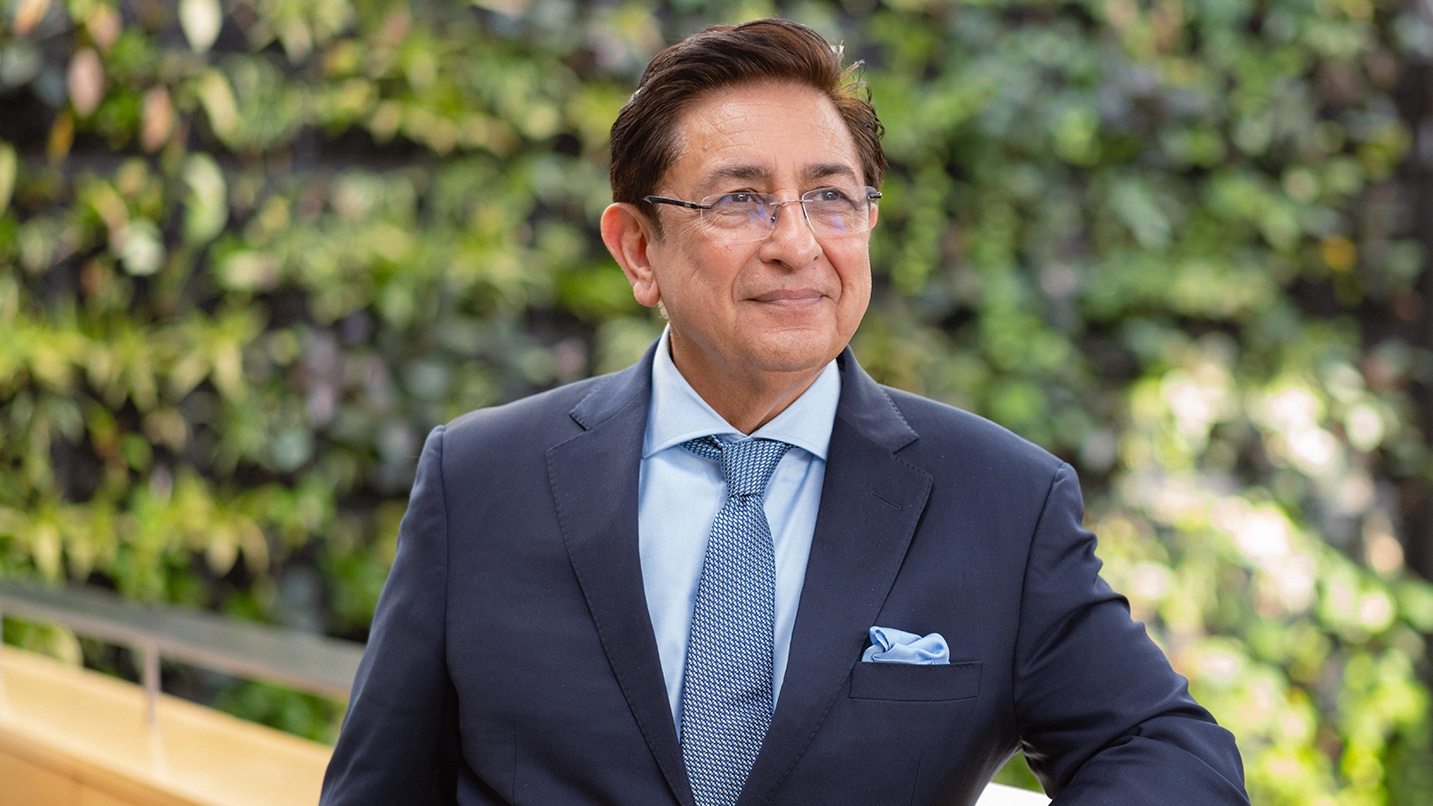 Dr. Anjum Siddiqui with the Guelph-Humber plant wall in behind