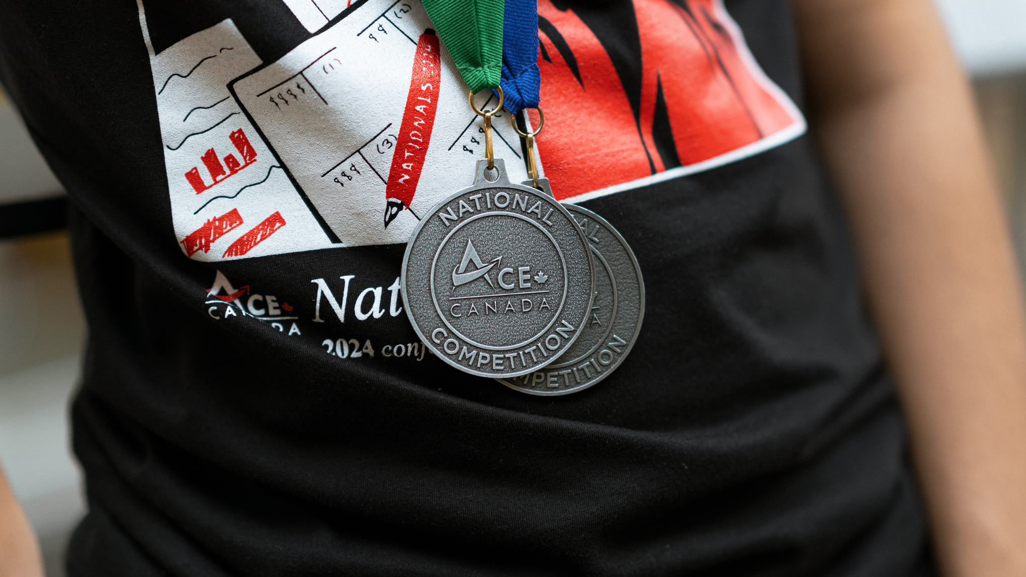 close-up of two ACE Canada medals worn by recipient