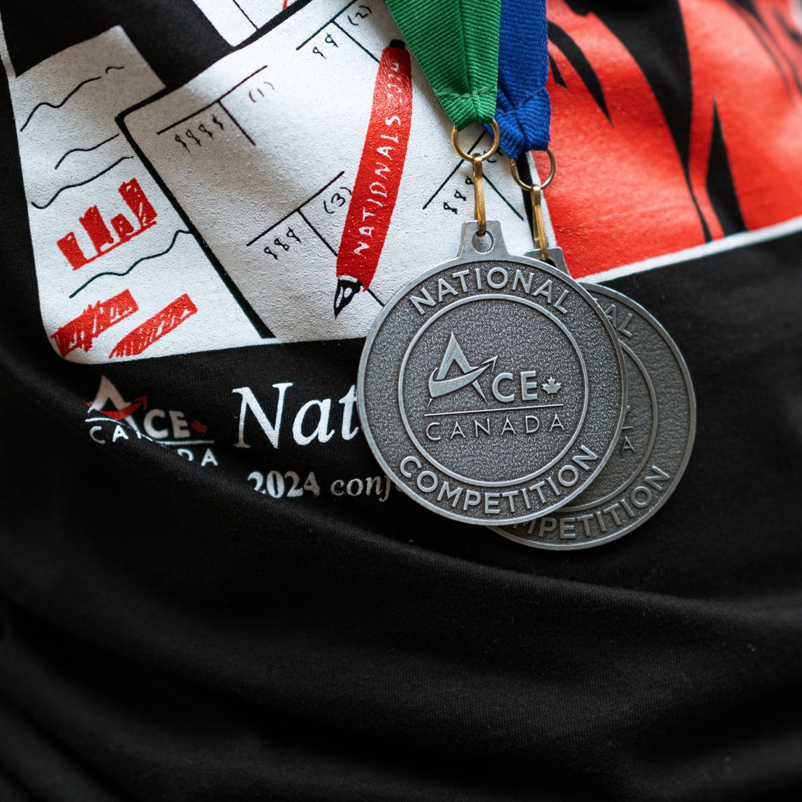 close-up of two ACE Canada medals worn by recipient