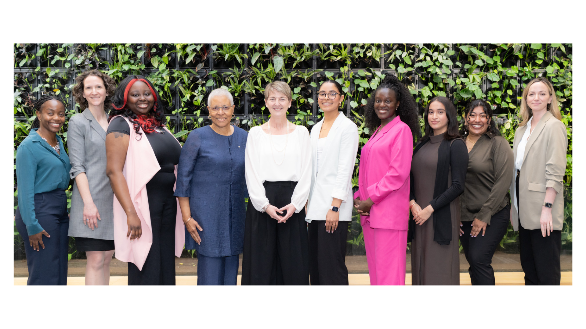 A group of outstanding women standing together for a photo