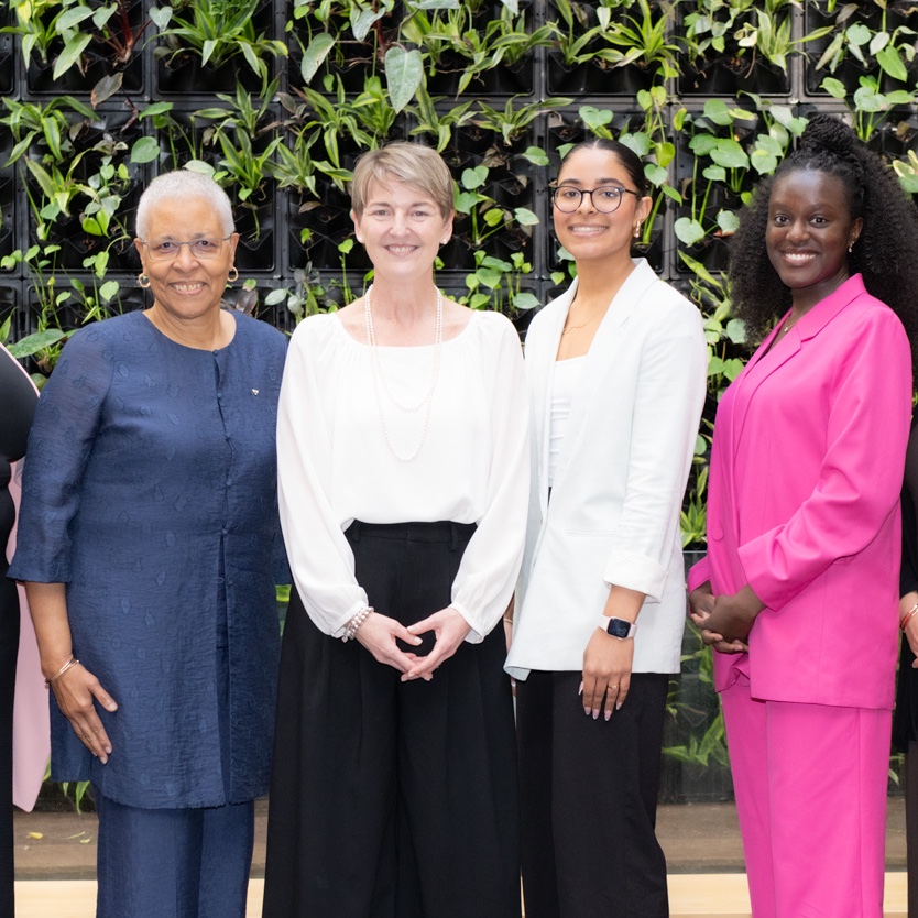 A group of outstanding women standing together for a photo