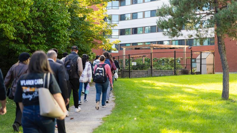 A group of students walking toward the Humber Food Learning Garden