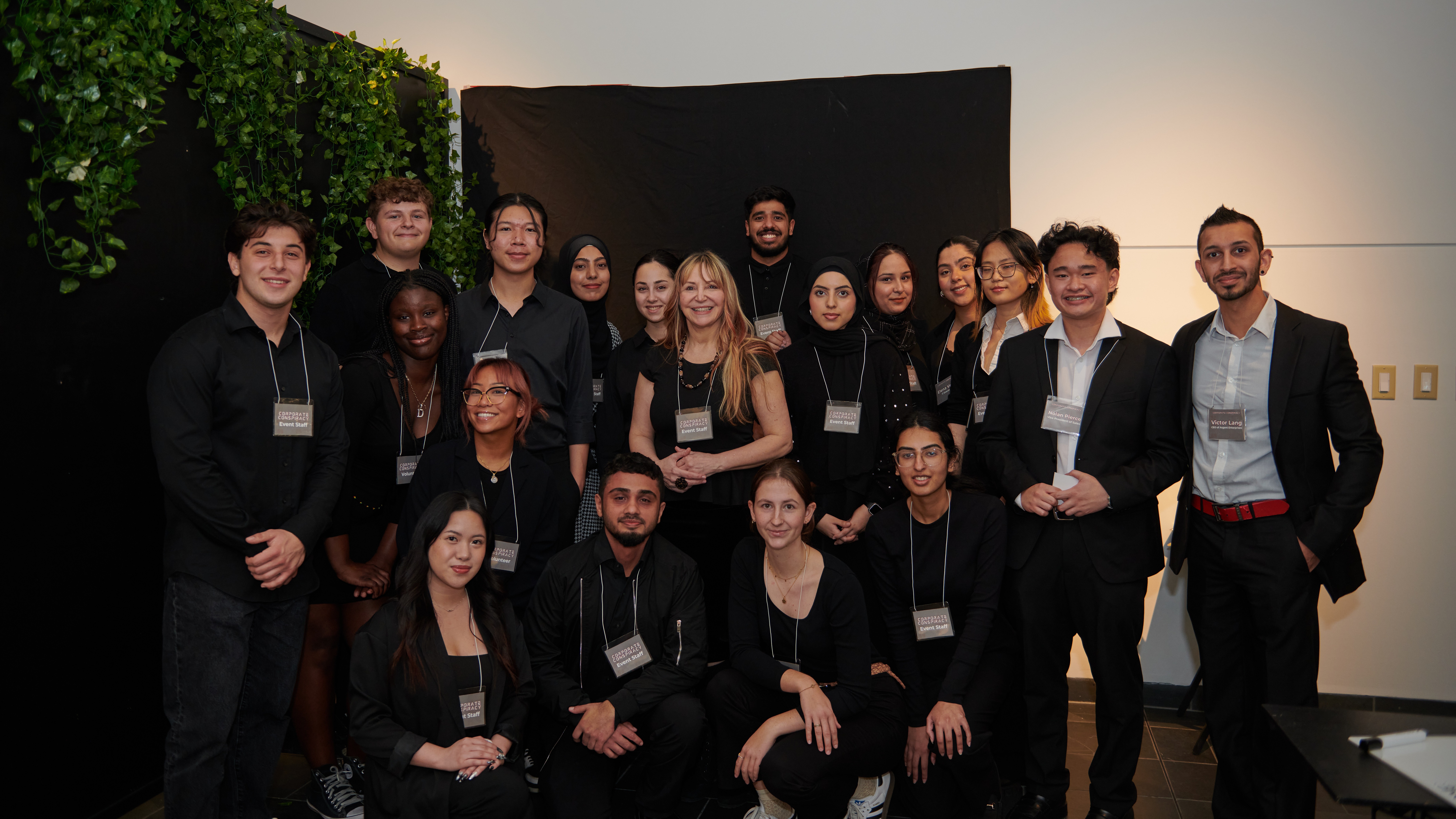 A group of people posing while wearing name tags