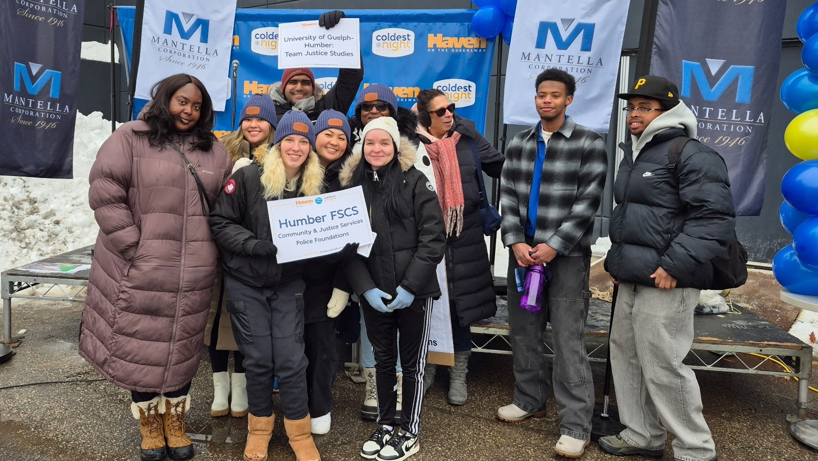 A group of ten participants from the University of Guelph-Humber and Humber Polytechnic pose for a photo at the Coldest Night of the Year fundraiser