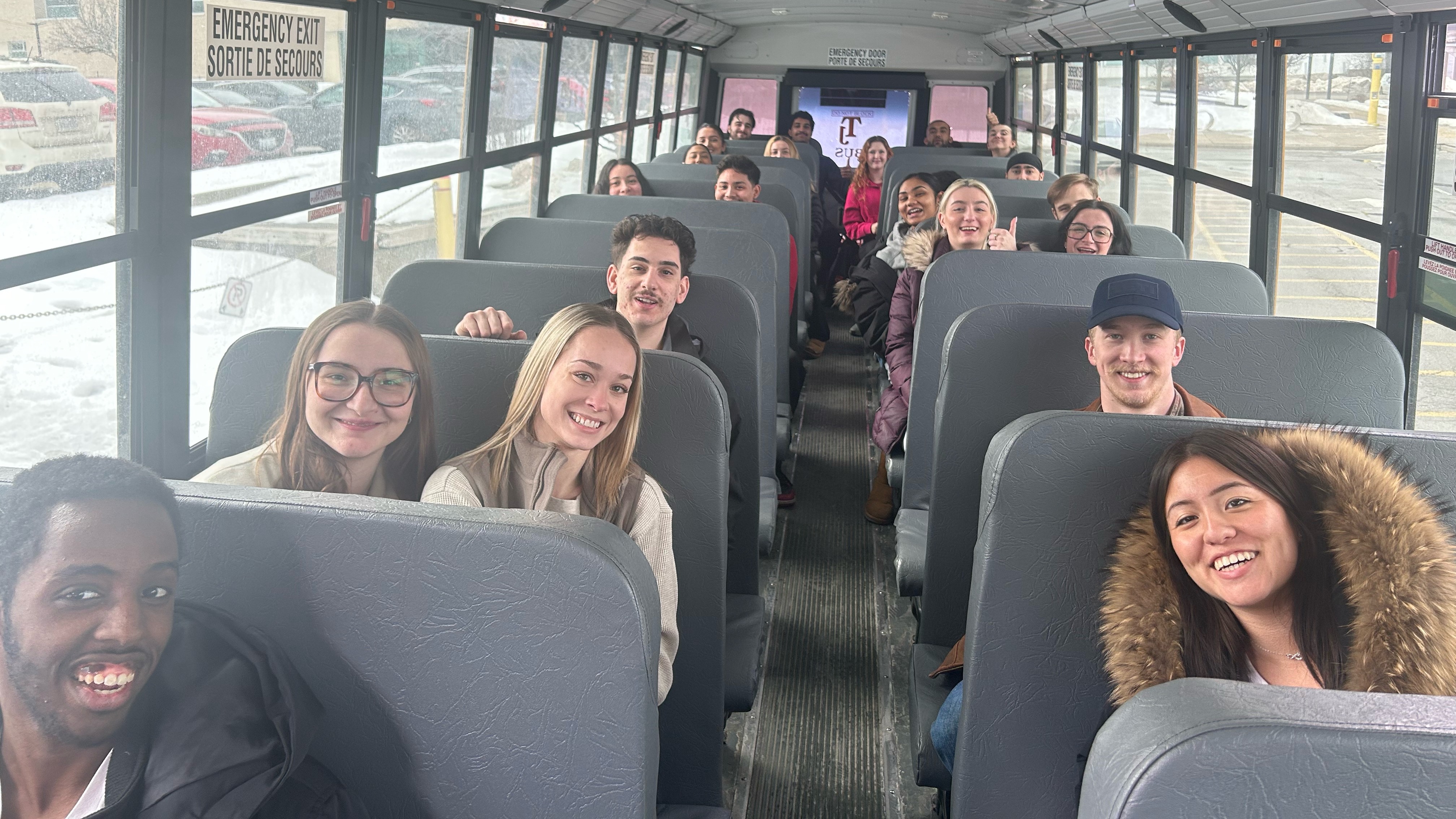 Students are seated on the school bus