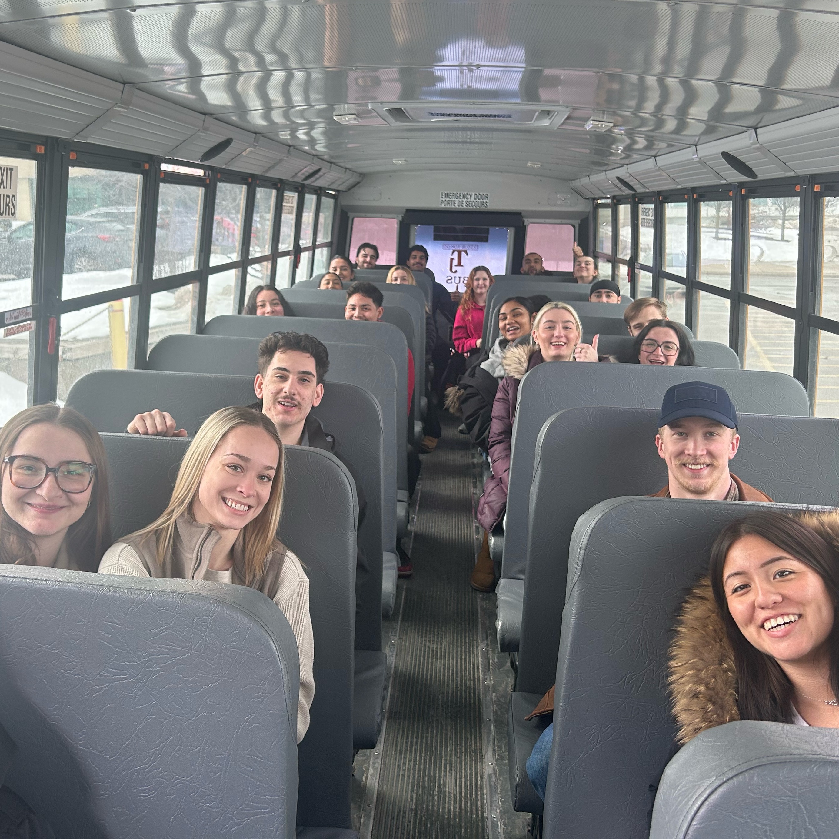 Students are seated on the school bus