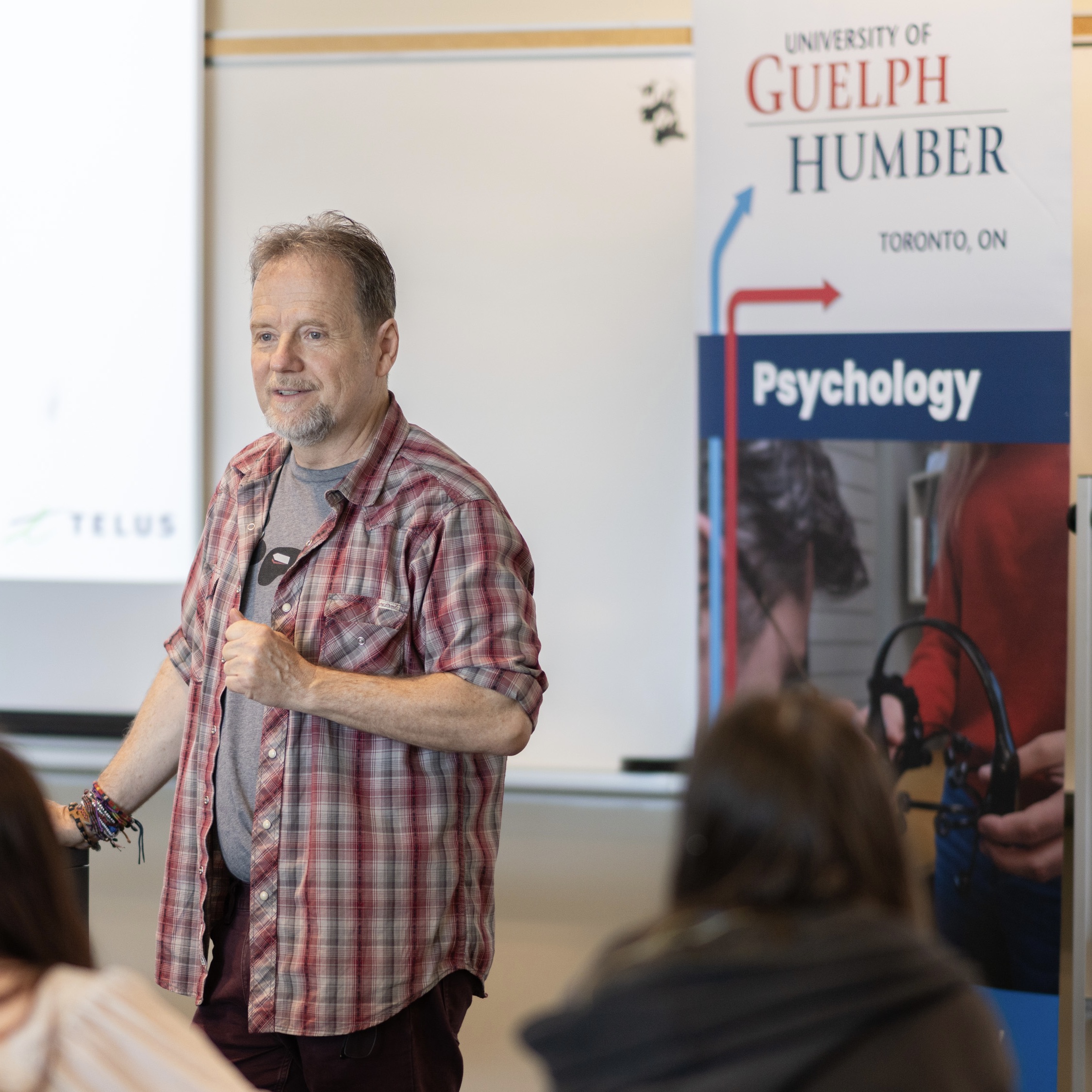 Bernard Szederkenyi delivers his lecture at the front of a classroom