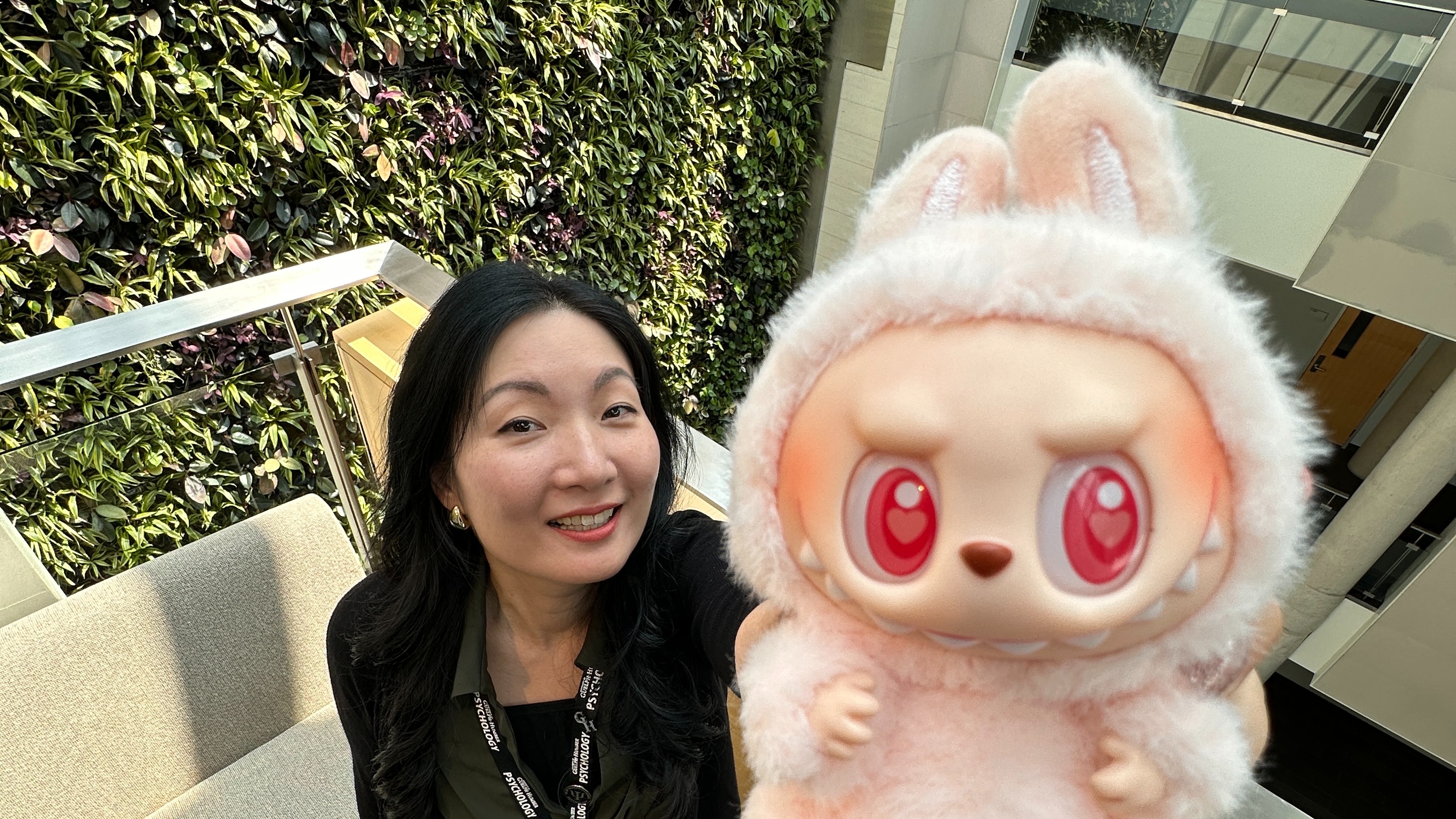 Dr. Alice Kim holds a pink Labubu up close to the camera