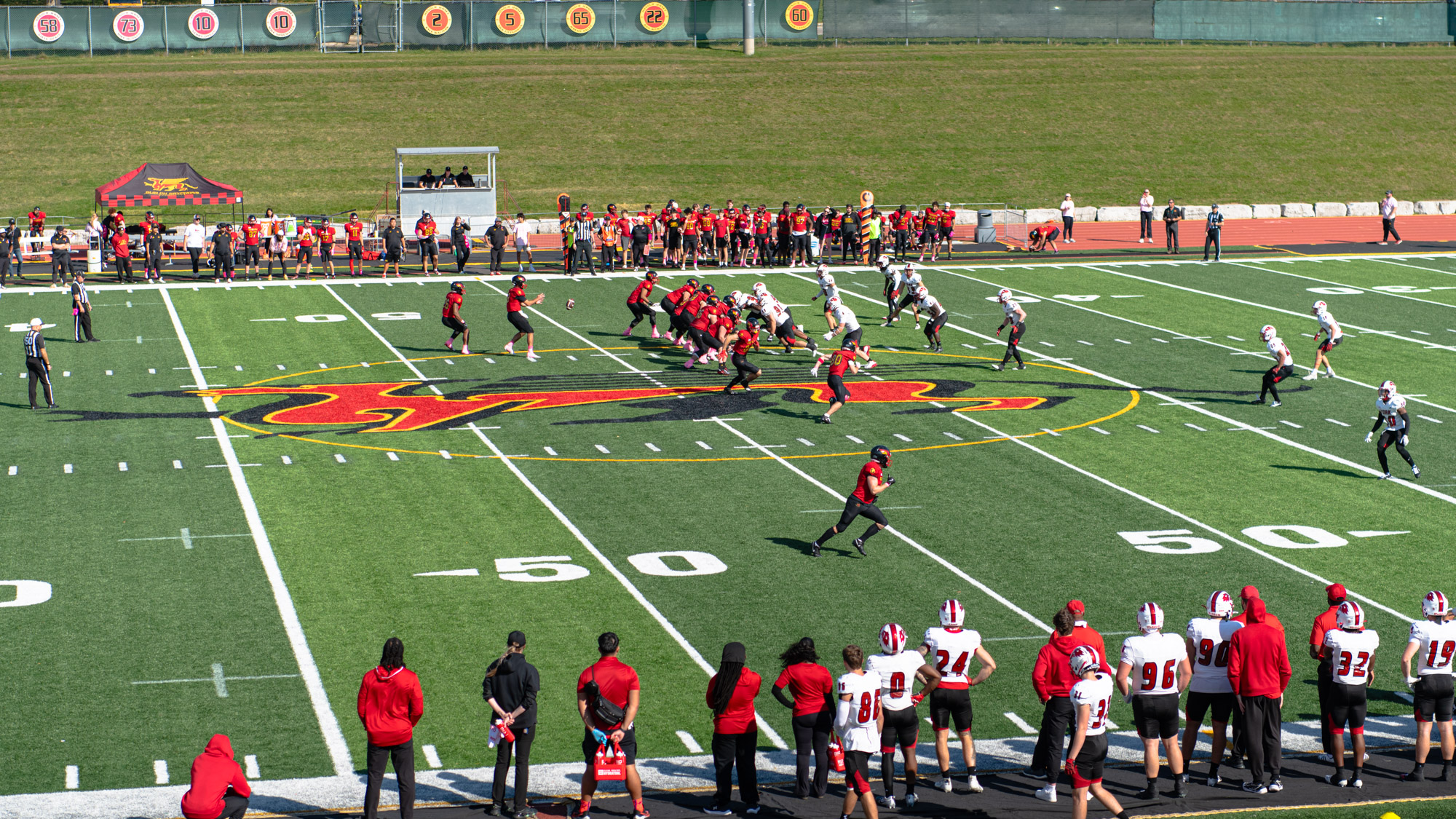 The Guelph Gryphons play football on the field with the York Lions