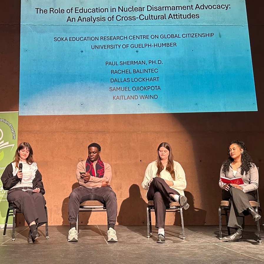 SERC-GC RAs present their research on the stage in Winnipeg