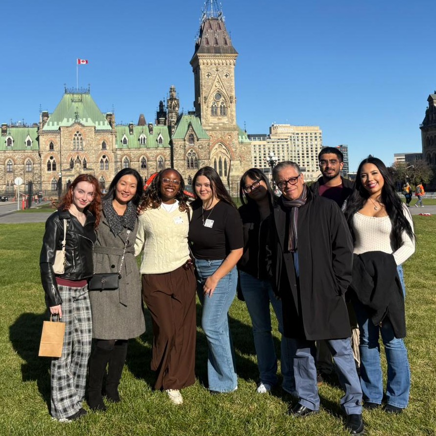 The six Agora Fellows, Dr. Kim, and Dr. Bragues stand in front of Parliament Hill