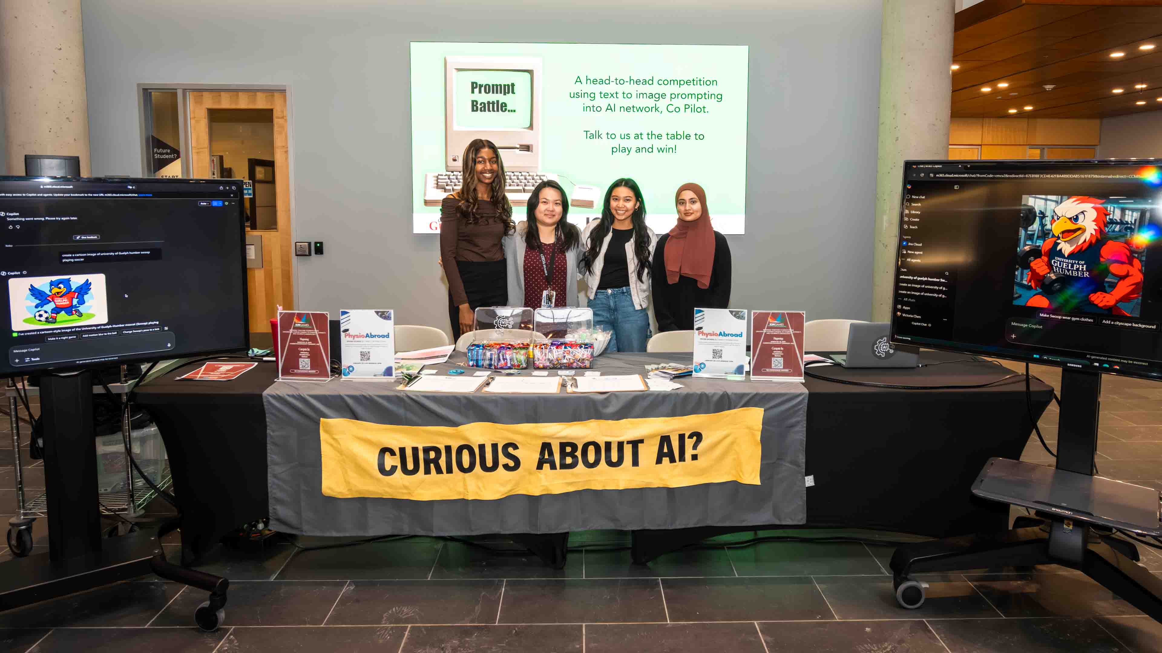 Four students stand at a booth with a banner that says "curious about ai?"