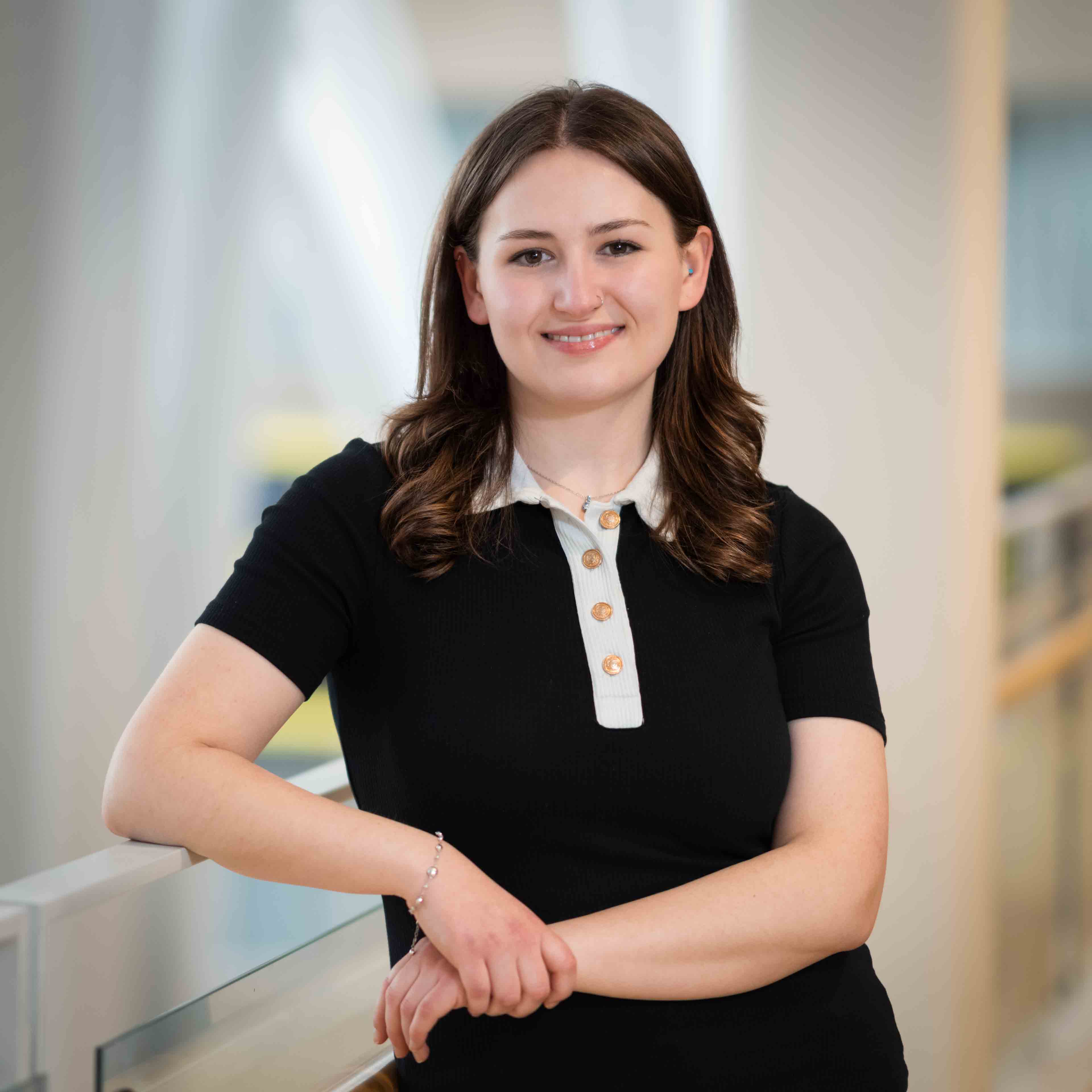 Sydney Lytwyn leans on a railing