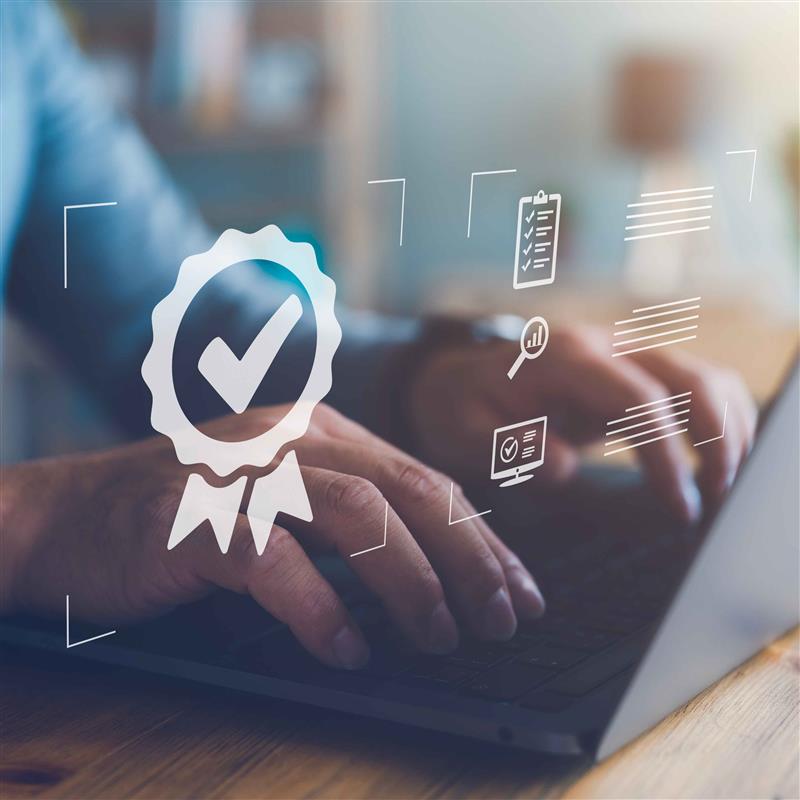 Person types on a laptop with a checkmark and other symbols overtop