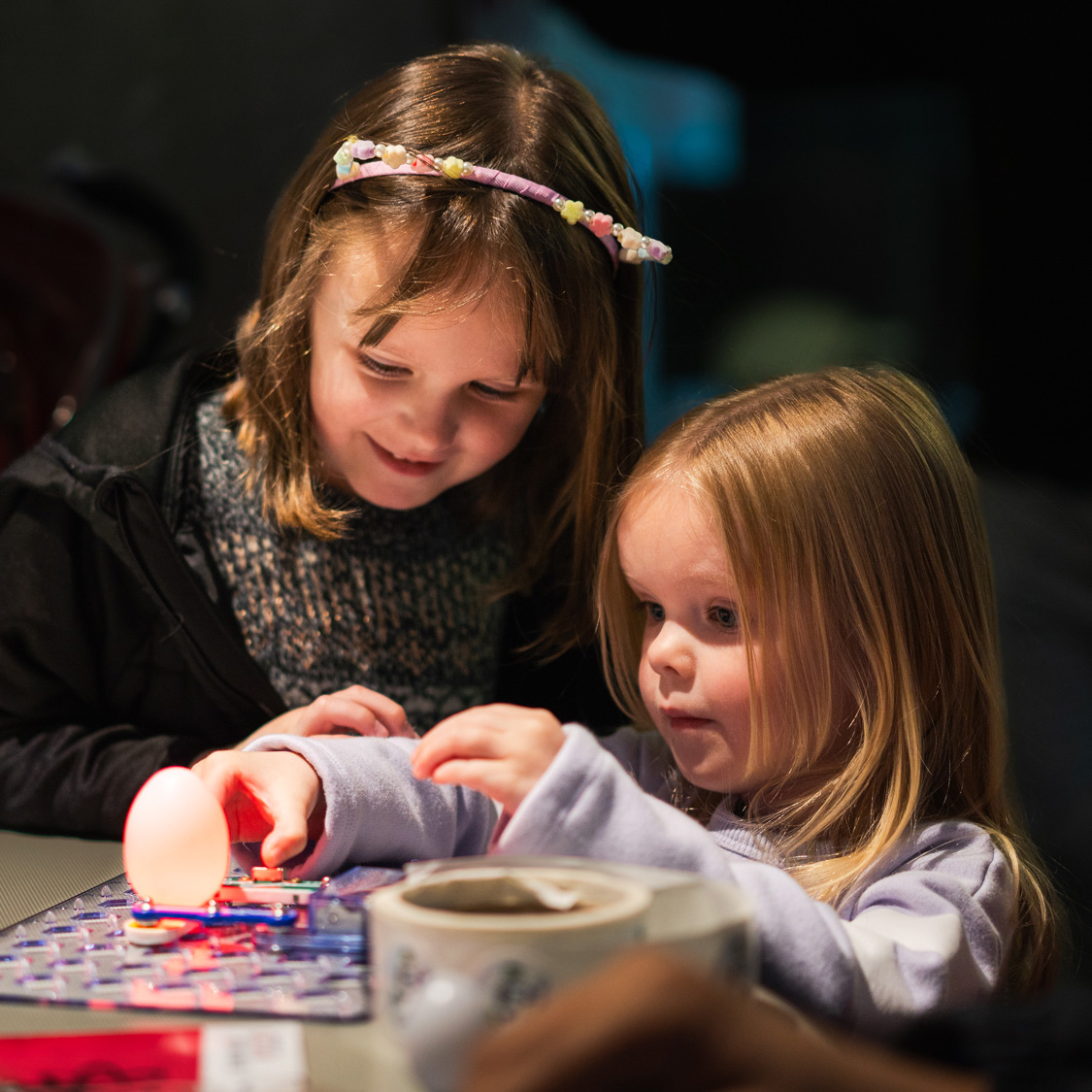 Two children look at an interactive exhibit at Science Rendezvous 2026