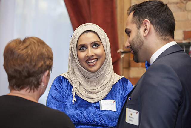 Male and female guests chatting