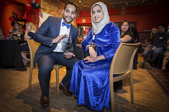 Prince Khan and his fiancee pose with his award