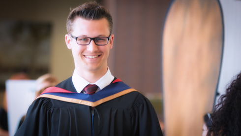 Smiling student at convocation 2014