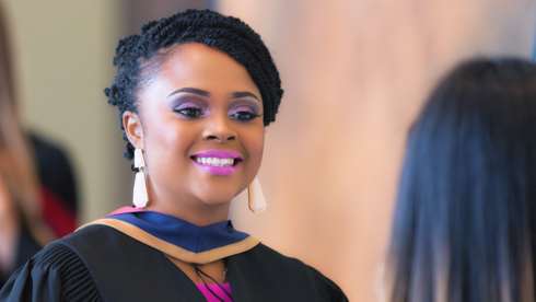 Smiling student at convocation 2014