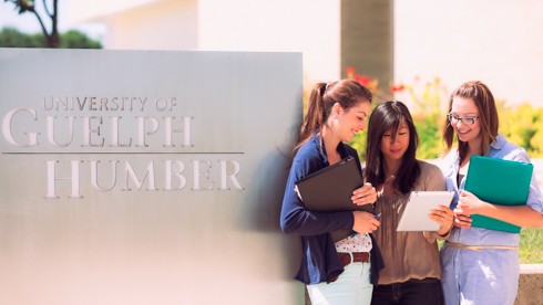 Students posing with Guelph-Humber sign