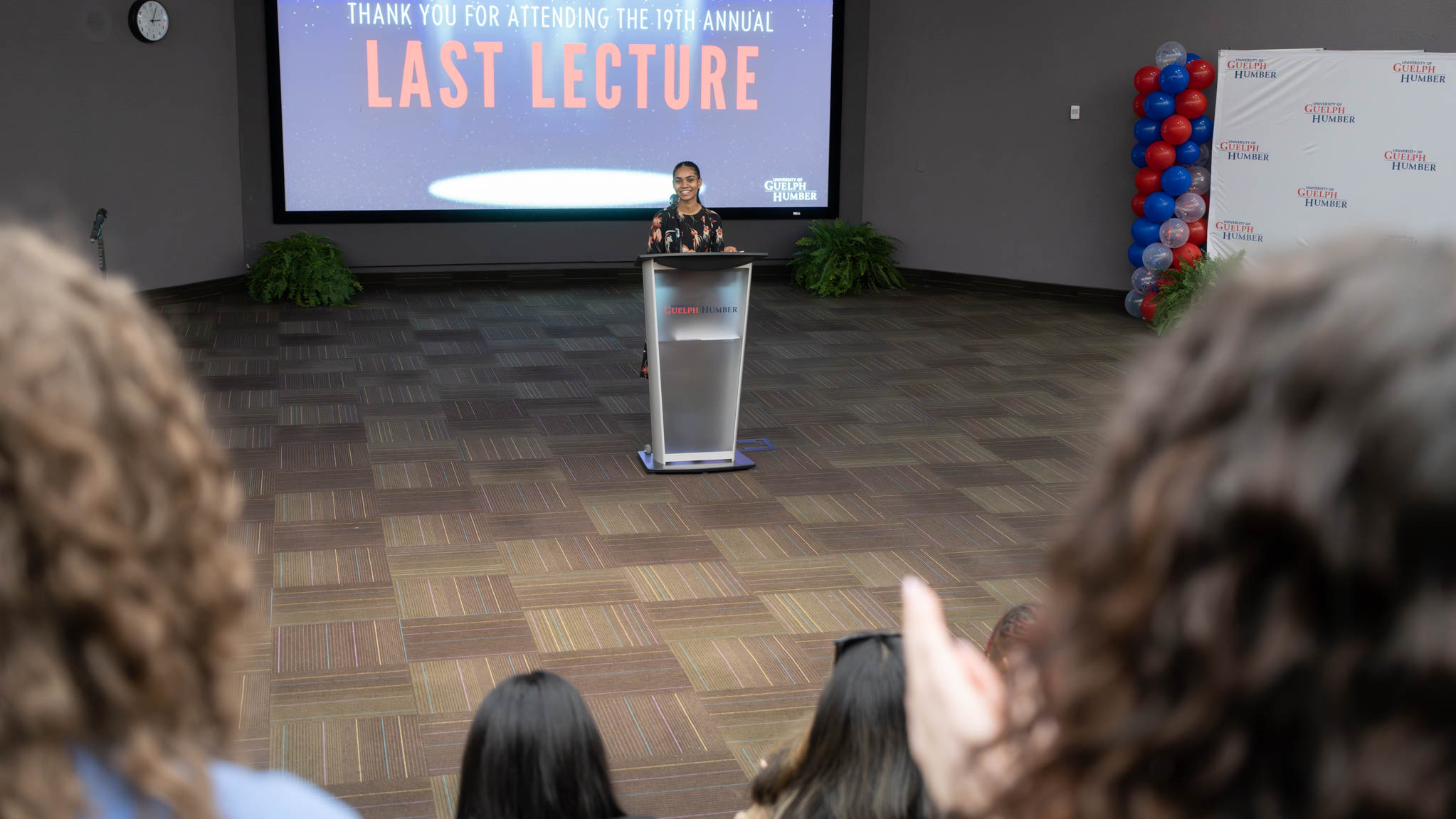 Ruth Oudit at podium at Last Lecture event