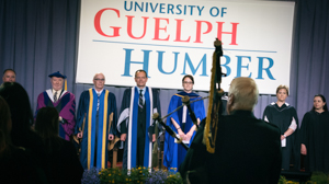 UofGH faculty gathers on stage at Convocation