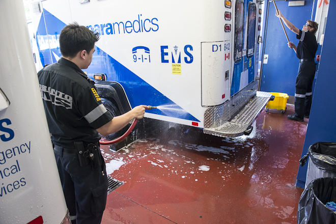 Paramedics wash ambulance