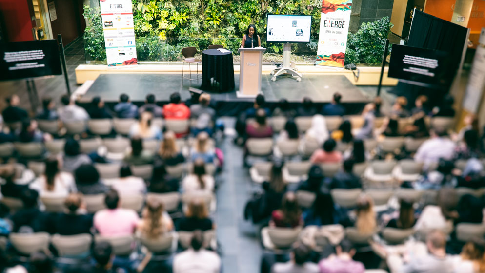 Looking Down - Takara Small – Special Guest - giving speech at podium_