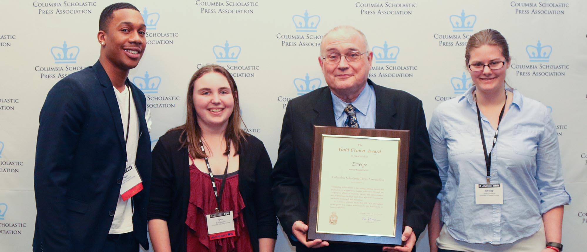 UofGH's representatives hold their prize for Emerge