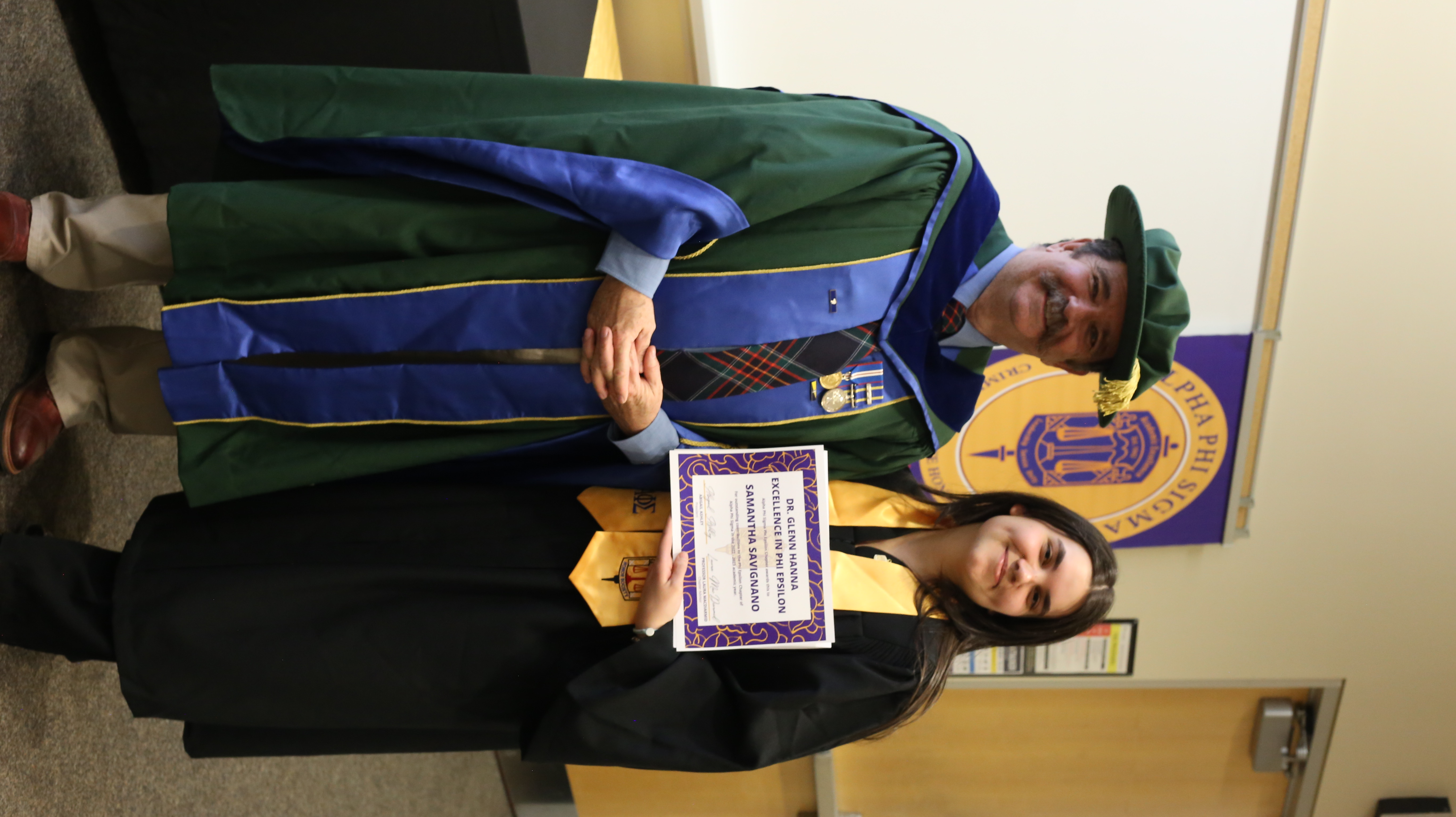 Glenna Hanna and Samantha Savignano in Alpha Phi Sigma regalia