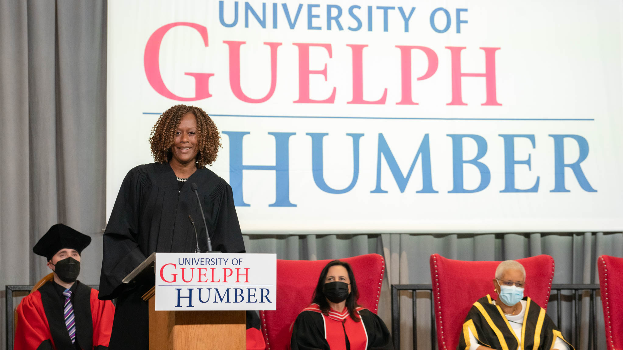 Photo of Jacqueline Edwards speaking at a lectern