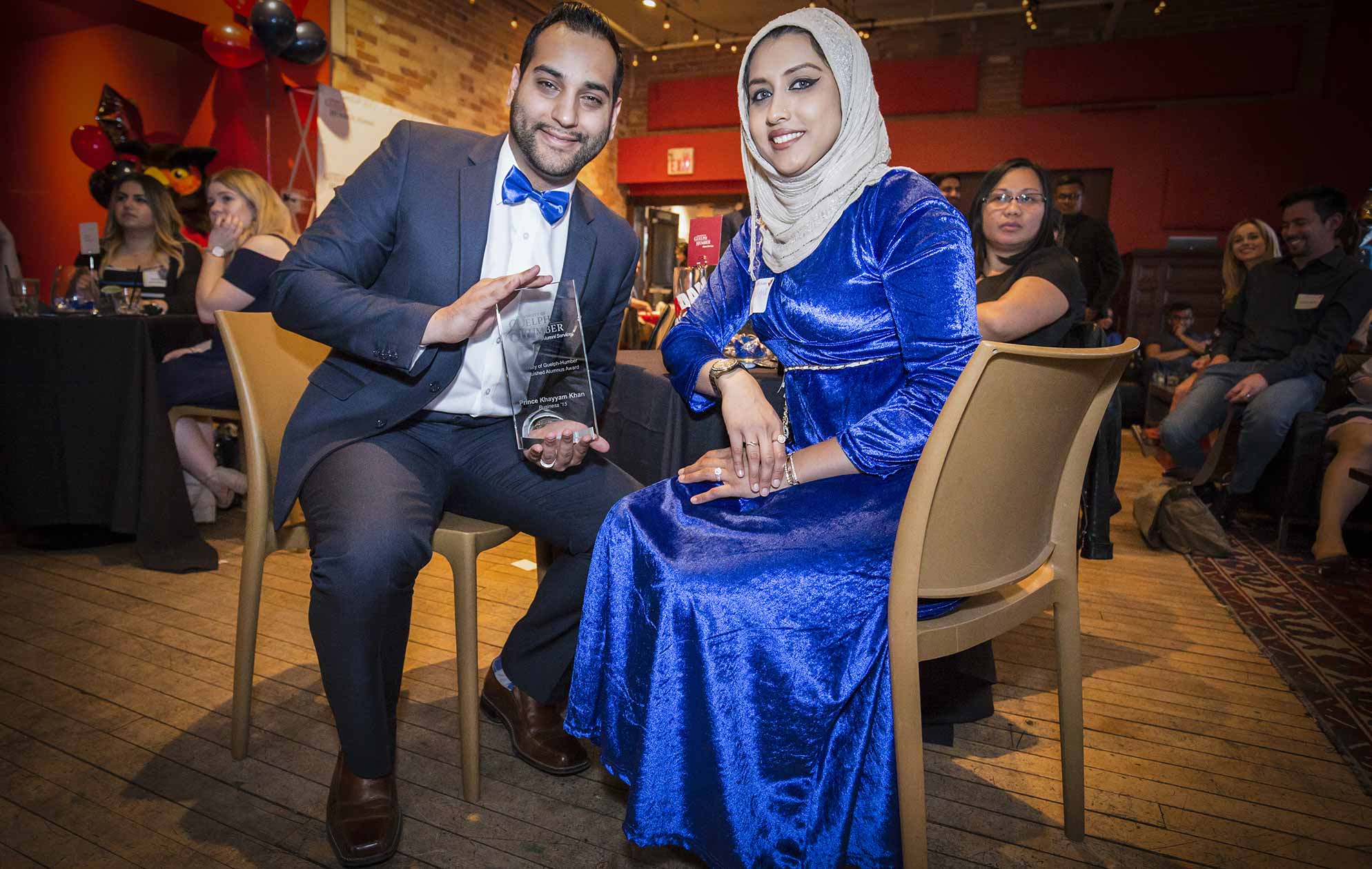 Prince Khan, left, poses with his fiancee.