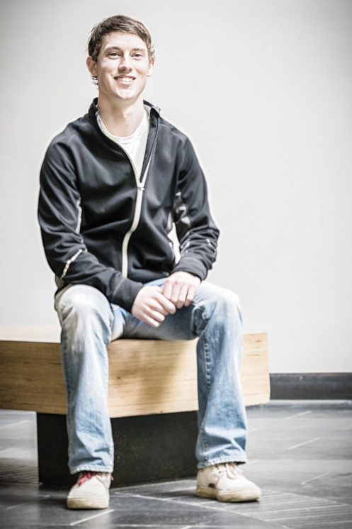 Sam Kirwin sits in the UofGH Atrium