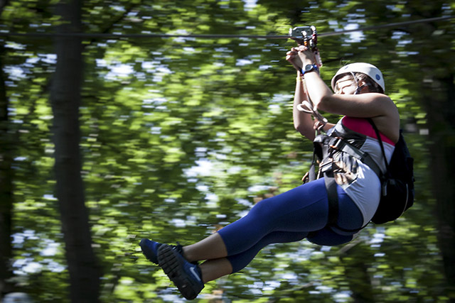 An alum zips through the trees