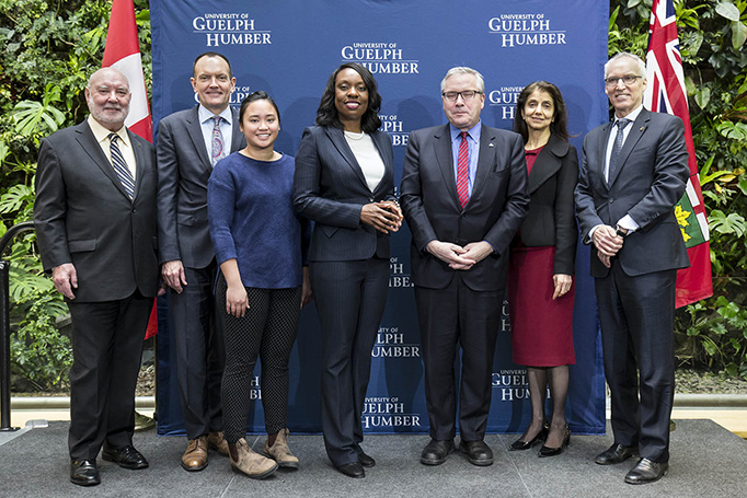 The speakers gathered for a photo