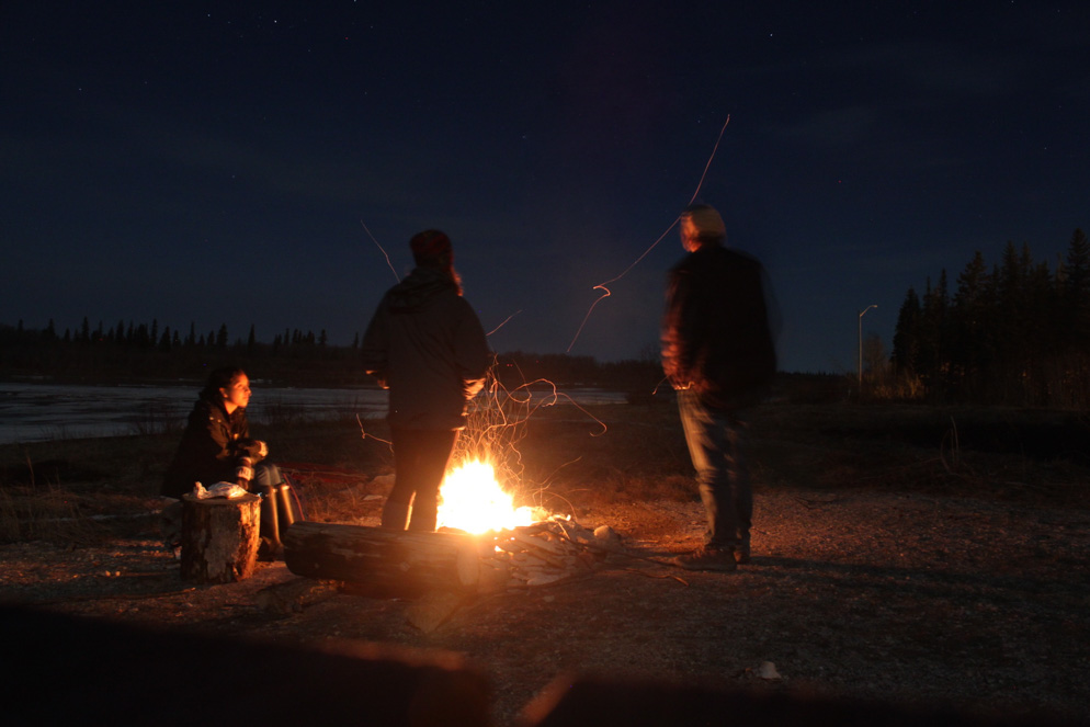 Photo of students surrounding campfire